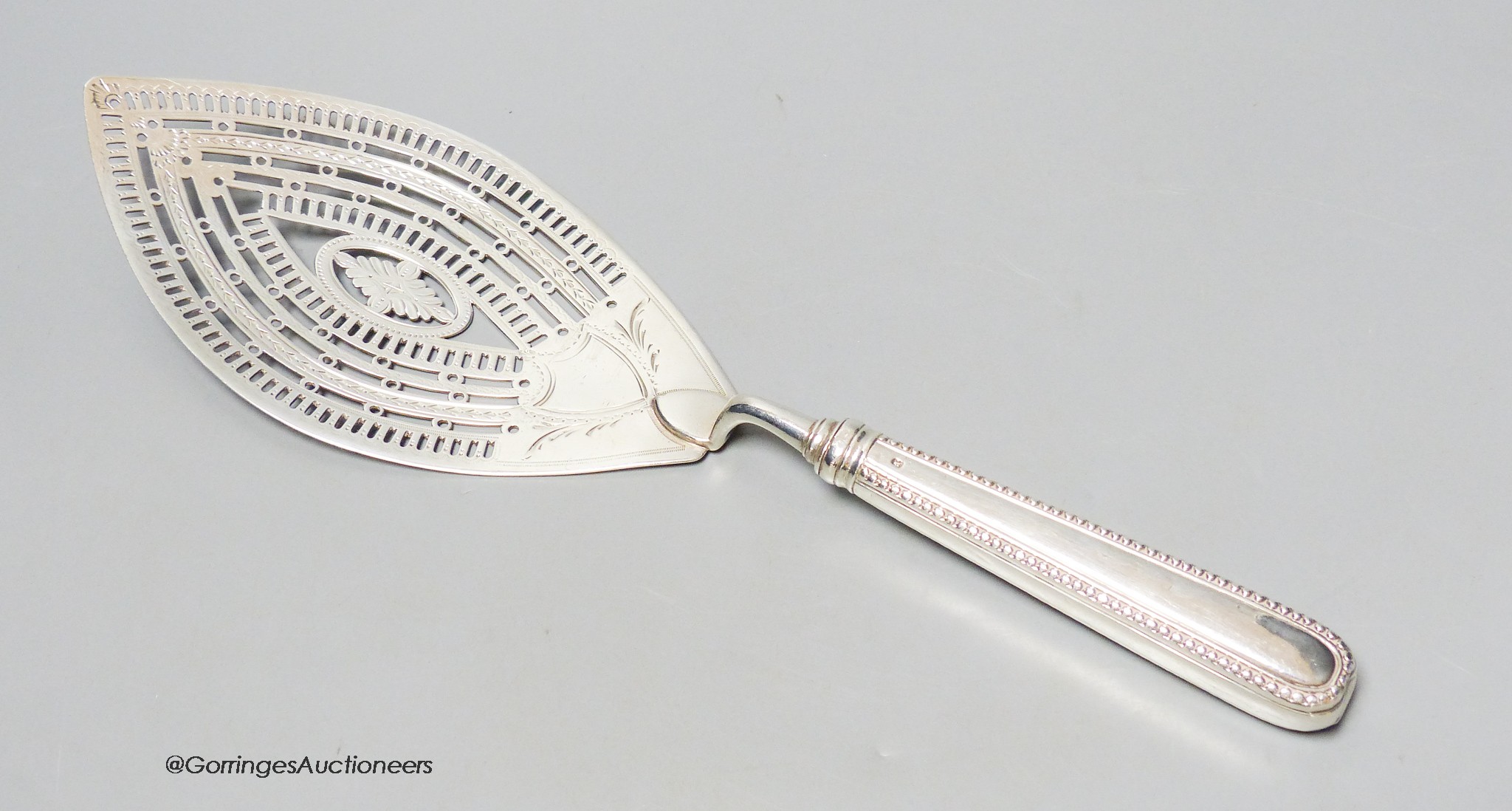 A large George IV silver fish slice, William Abdy I, London, 1784, 30.2cm, loaded handle, gross 4.5oz.